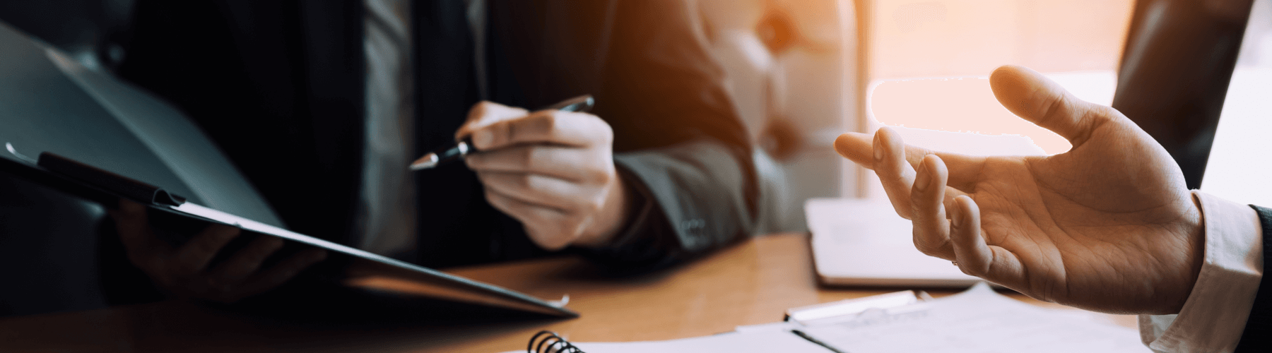 close up of businessman or client across the desk from a lawyer