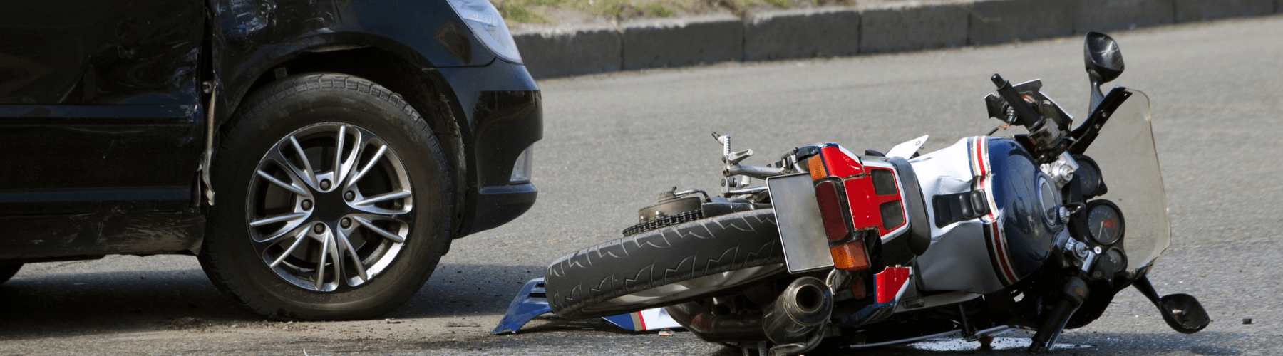 collision with vehicle with wrecked bike on the ground