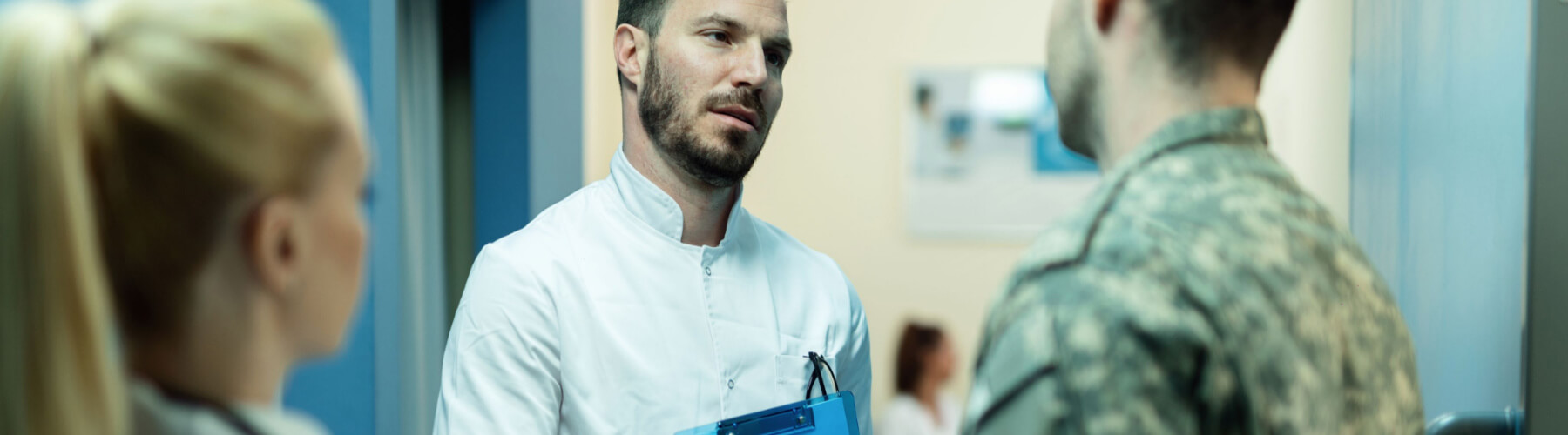 doctors shaking hands with military veteran