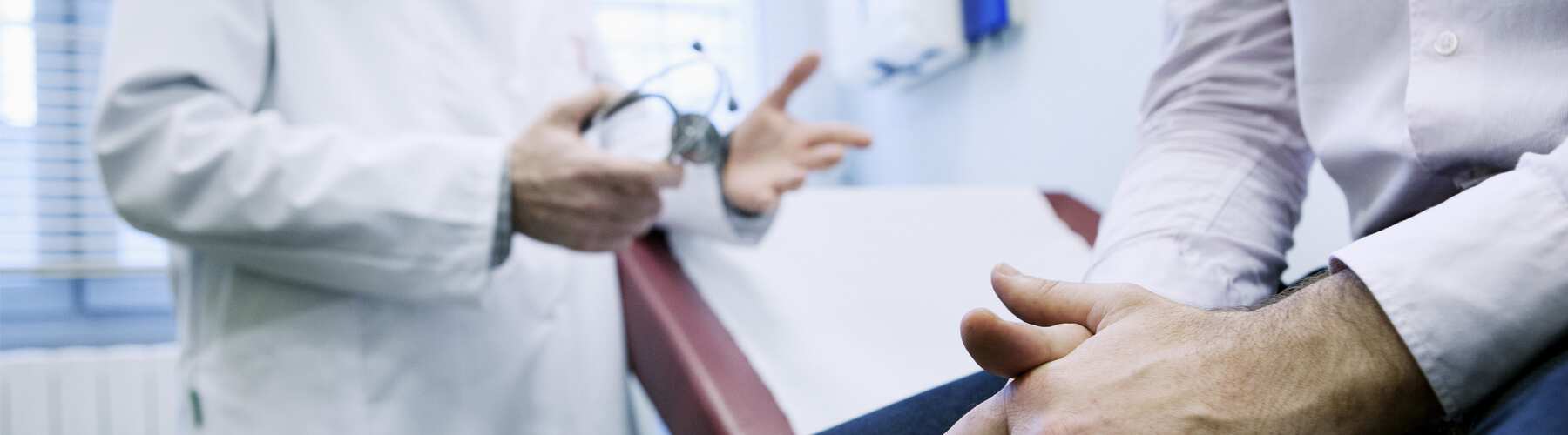 Mesothelioma patient talking to doctor, closeup of patient hand. Man In Consultation, Dialogue with doctor