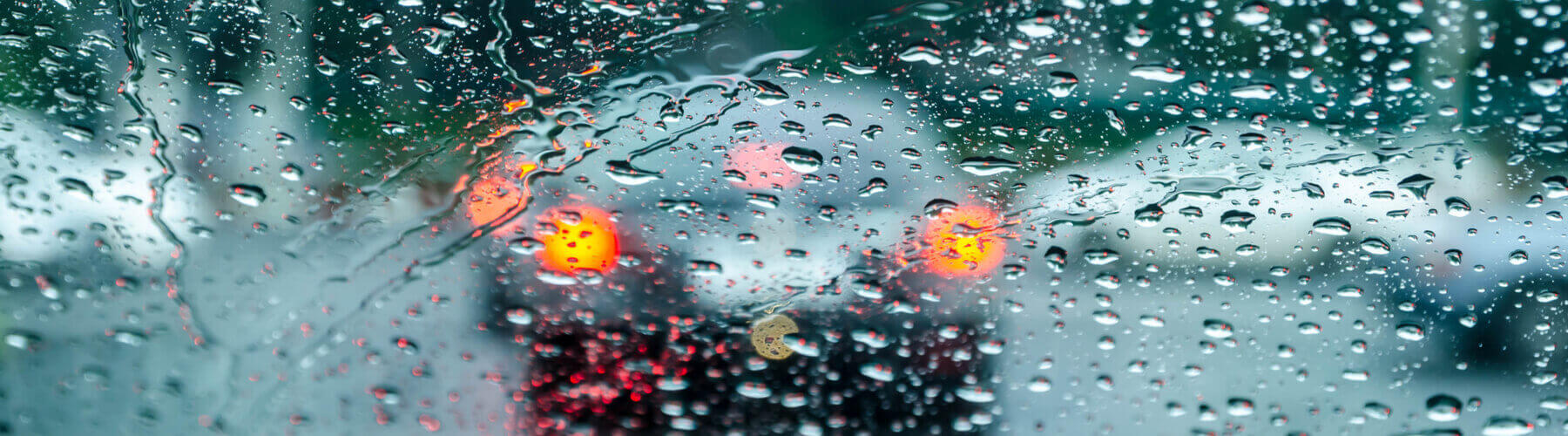 rain droplets obstructing view from windshield