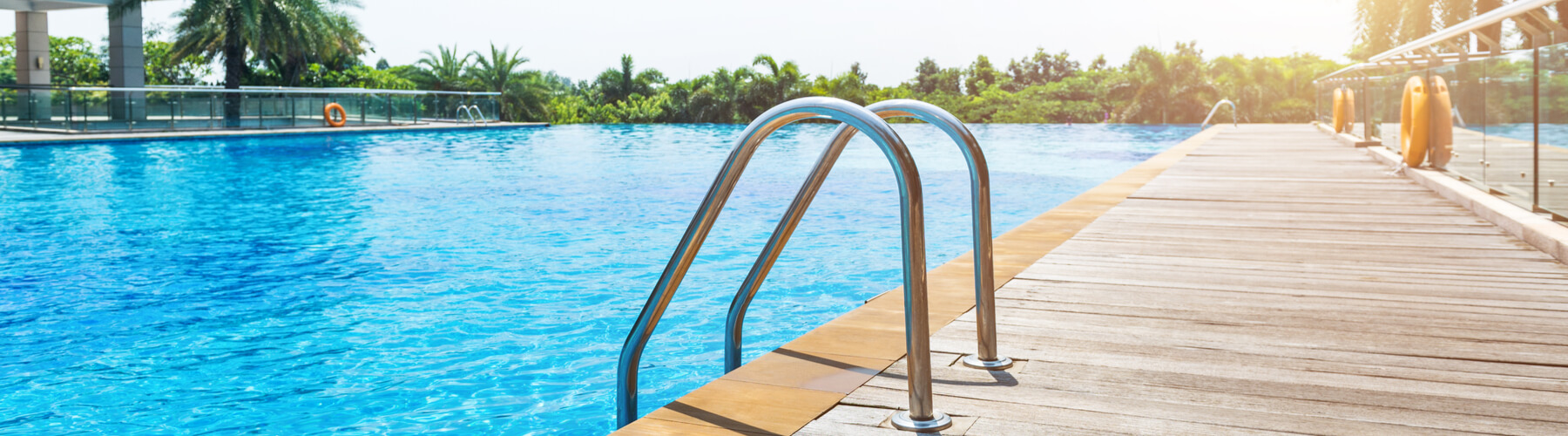 Swimming pool with stairs and wooden deck