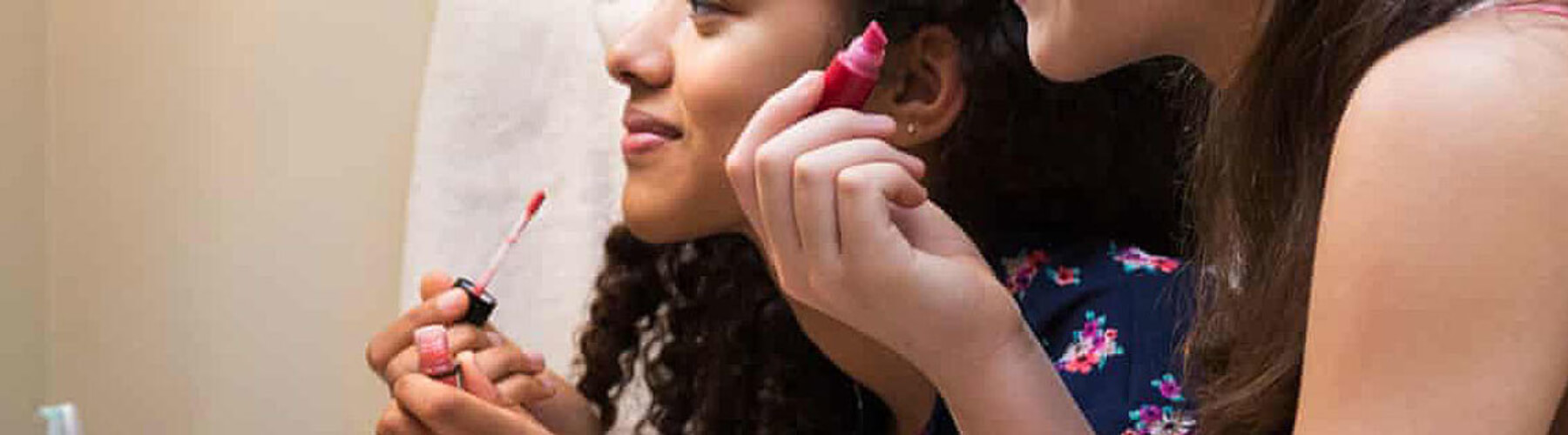 Young women applying makeup with possible asbestos contamination