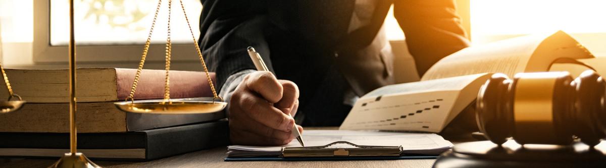 Attorney doing paperwork at desk