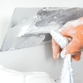 Construction worker constructing a plaster wall