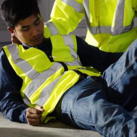 A man hurt on the job and is on the ground