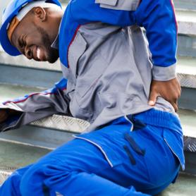 Worker Man Lying On Staircase After Slip And Fall Accident