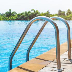 Swimming pool with stairs and wooden deck