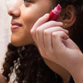 Young women applying makeup with possible asbestos contamination